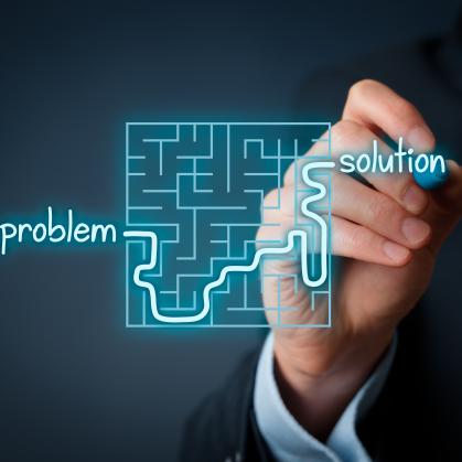 A graphic image of a person tracing a line through a maze, starting at the word problem and exiting the maze at the word solution 