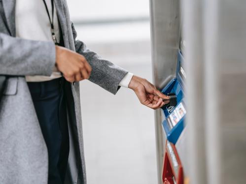 Woman depositing money at ATM