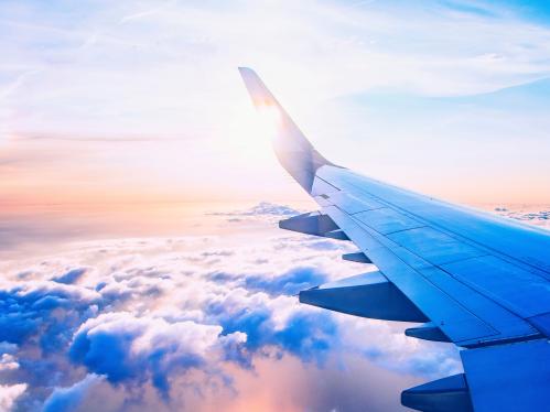 Plane wing over the clouds