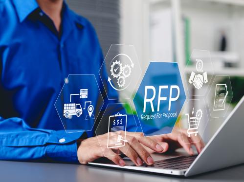  Request for Proposal Business Concept. Businessman working on laptop with icon representing Request for Proposal (RFP) process, including procurement, bidding, contract management, and logistics.